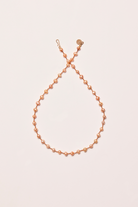 Collier 'Bird Pêche' avec perles pêche – bijou délicat fait main