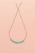 Collier en turquoise sur cordon — IVARENE Paris